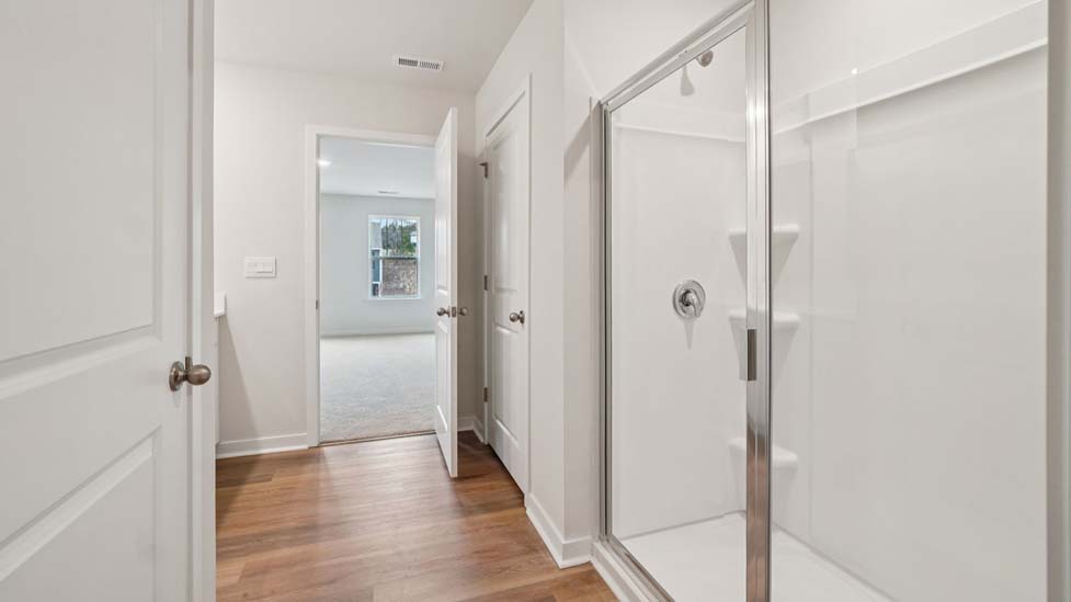 Bathroom with double sink vanity, and walk in shower