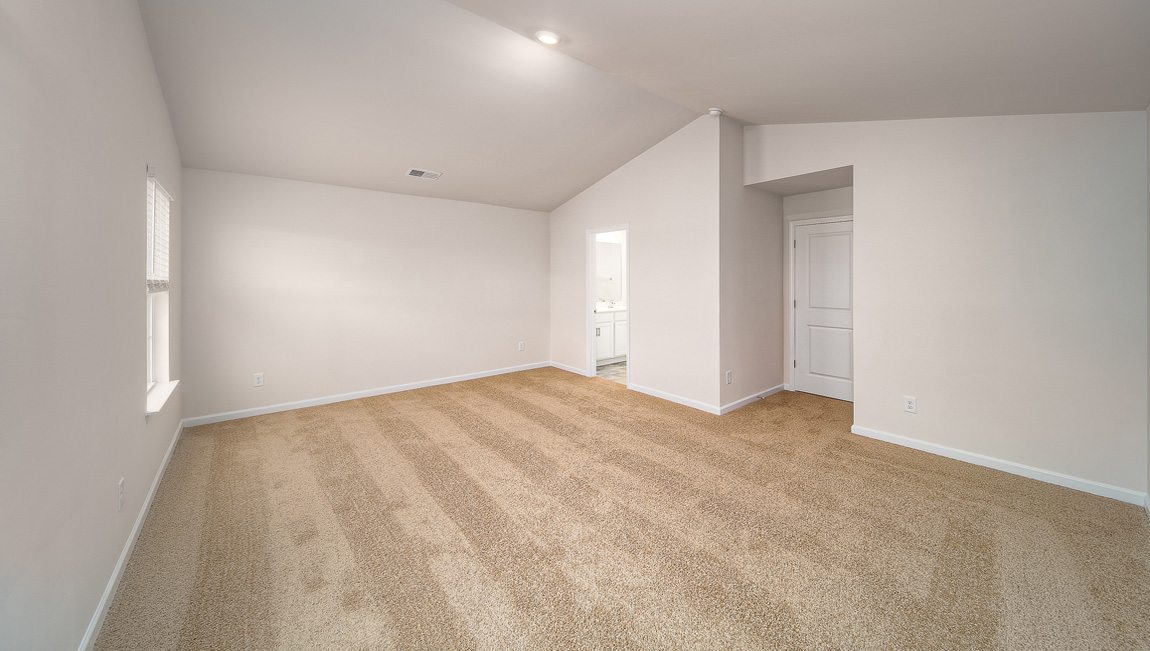 Primary bedroom, carpeted, two large windows