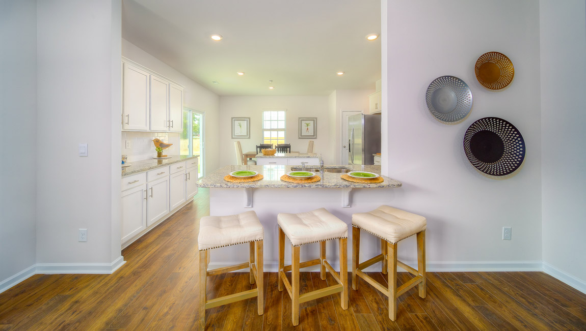 Kitchen and island with white cabinets