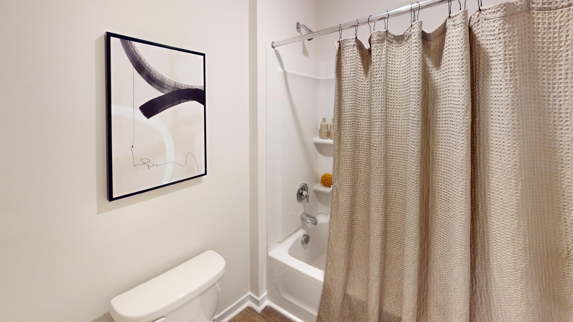 bathroom with bathtub and shower combination