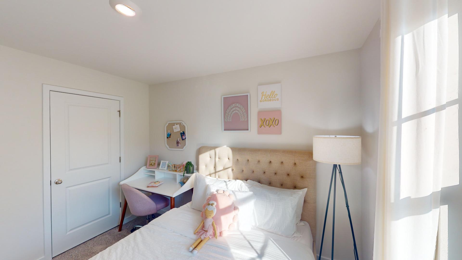 Carpeted bedroom with large window