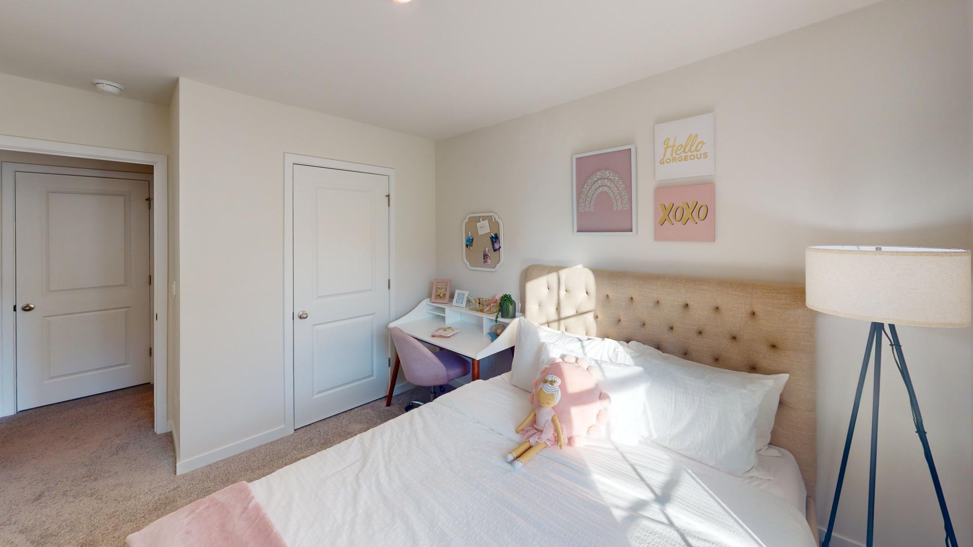 Carpeted bedroom with large window