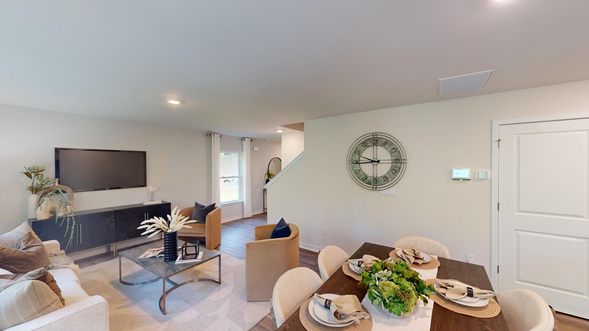 Dining area and living room beside kitchen