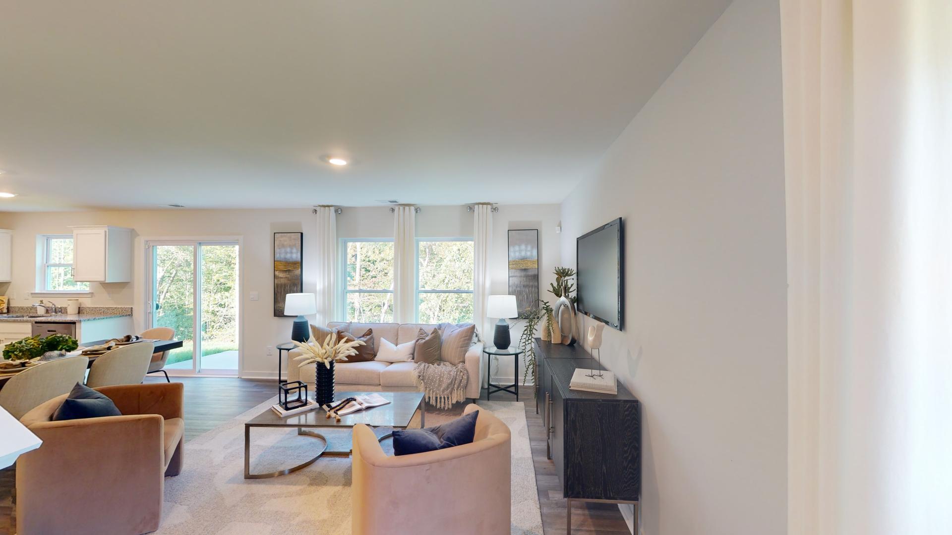 Dining area and living room beside kitchen