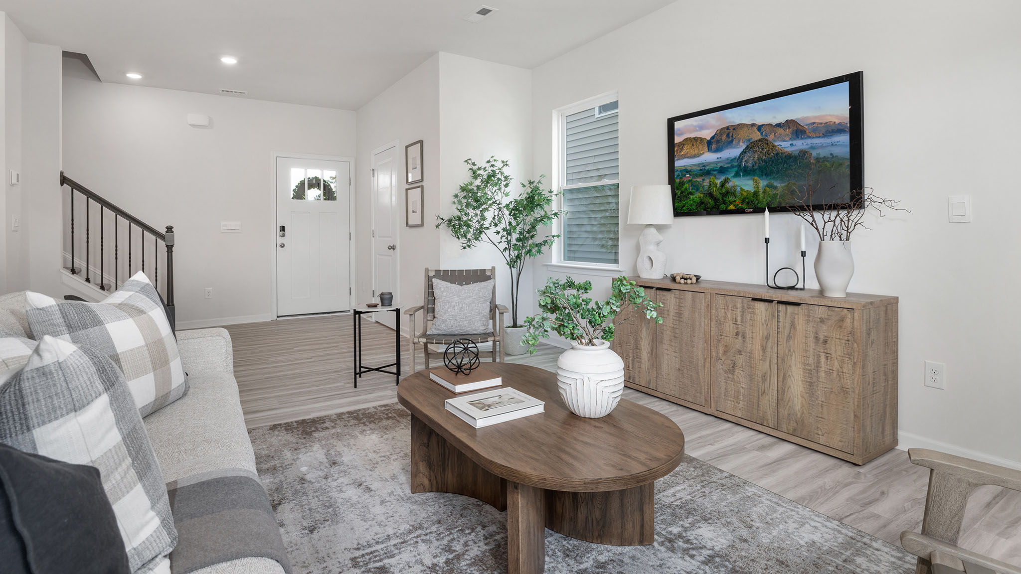 Spacious family room with large windows and fireplace