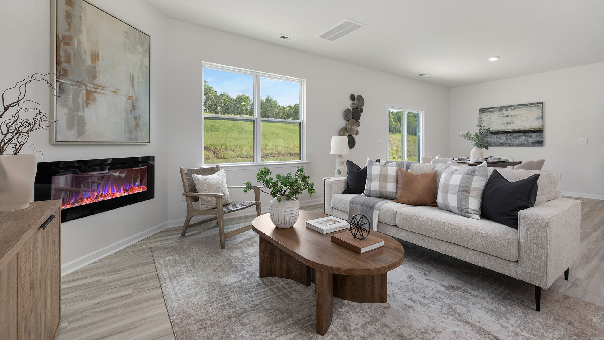 Spacious family room with large windows and fireplace