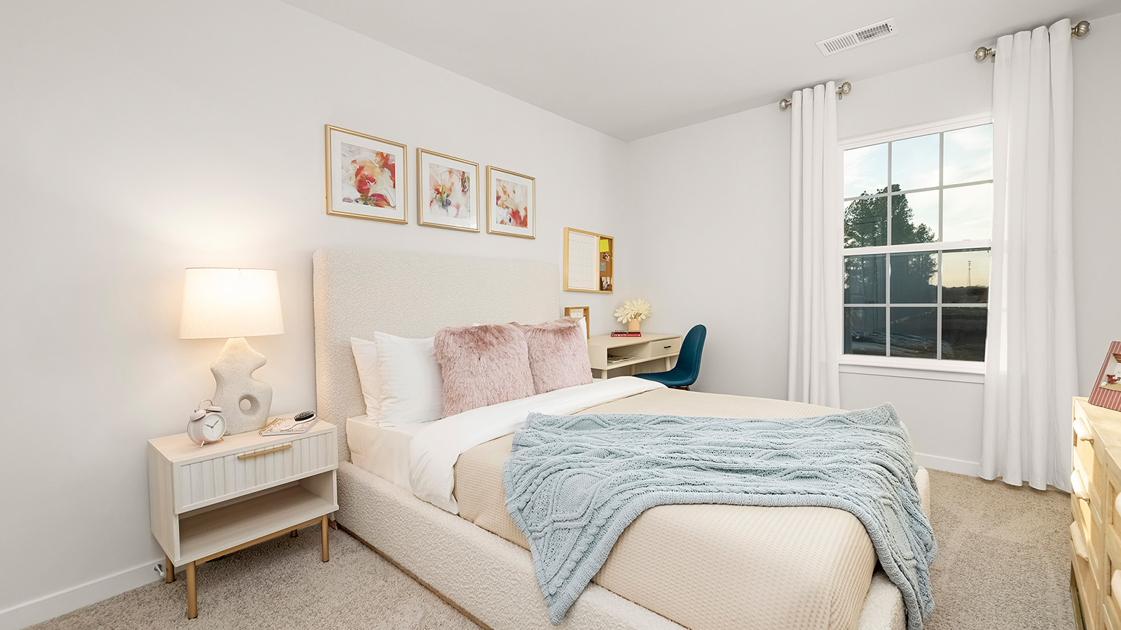 carpeted bedroom with large window