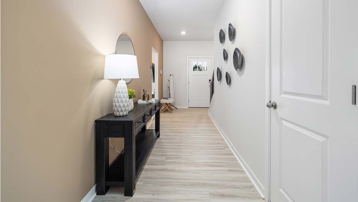 Welcoming foyer view of staircase