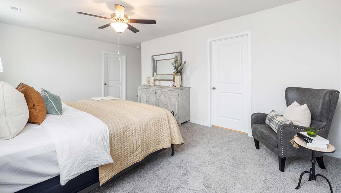 Carpeted bedroom with large window