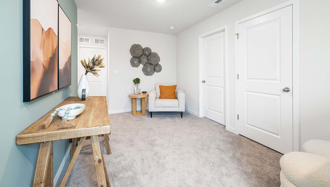 carpeted bedroom with small window