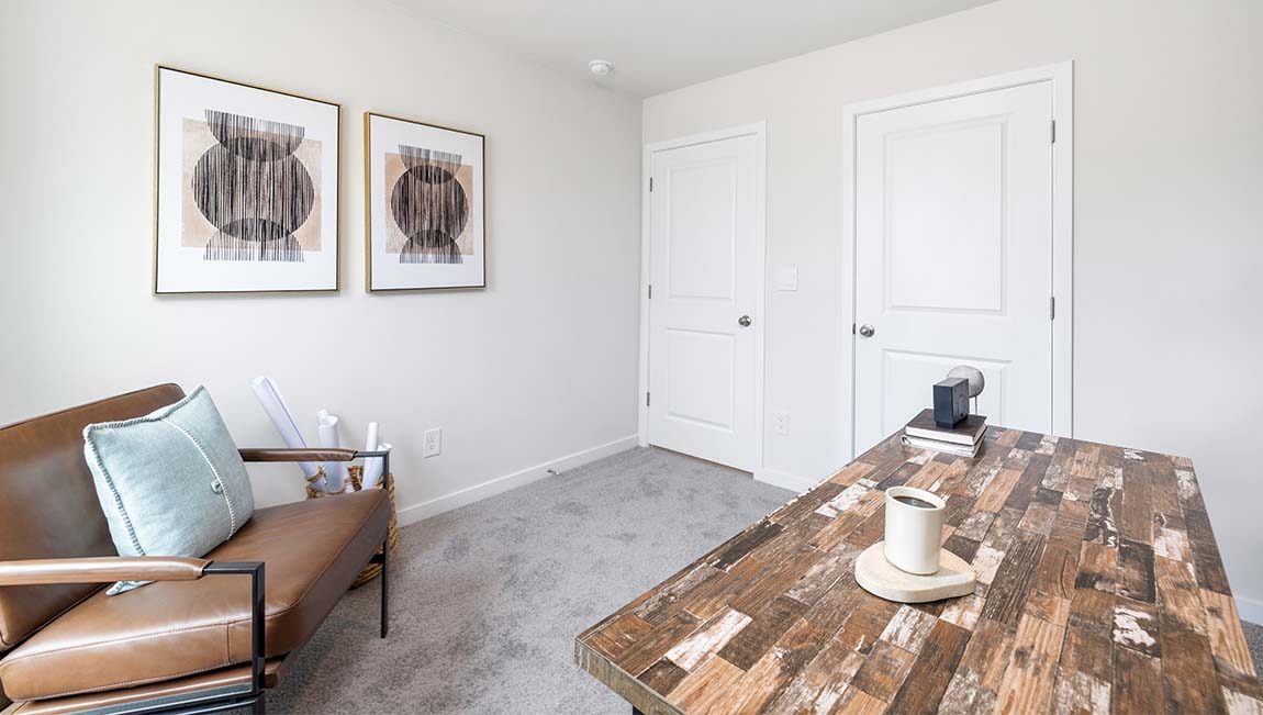 carpeted bedroom with small window