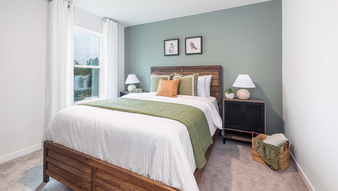 Carpeted bedroom with large window