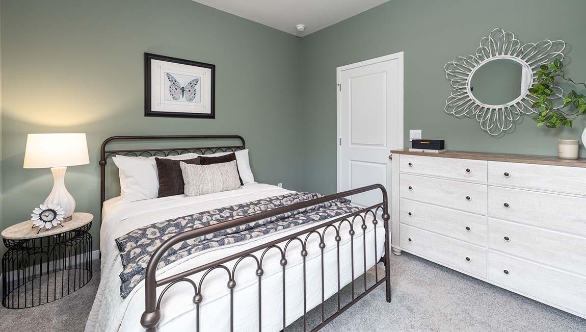 Carpeted bedroom with large window