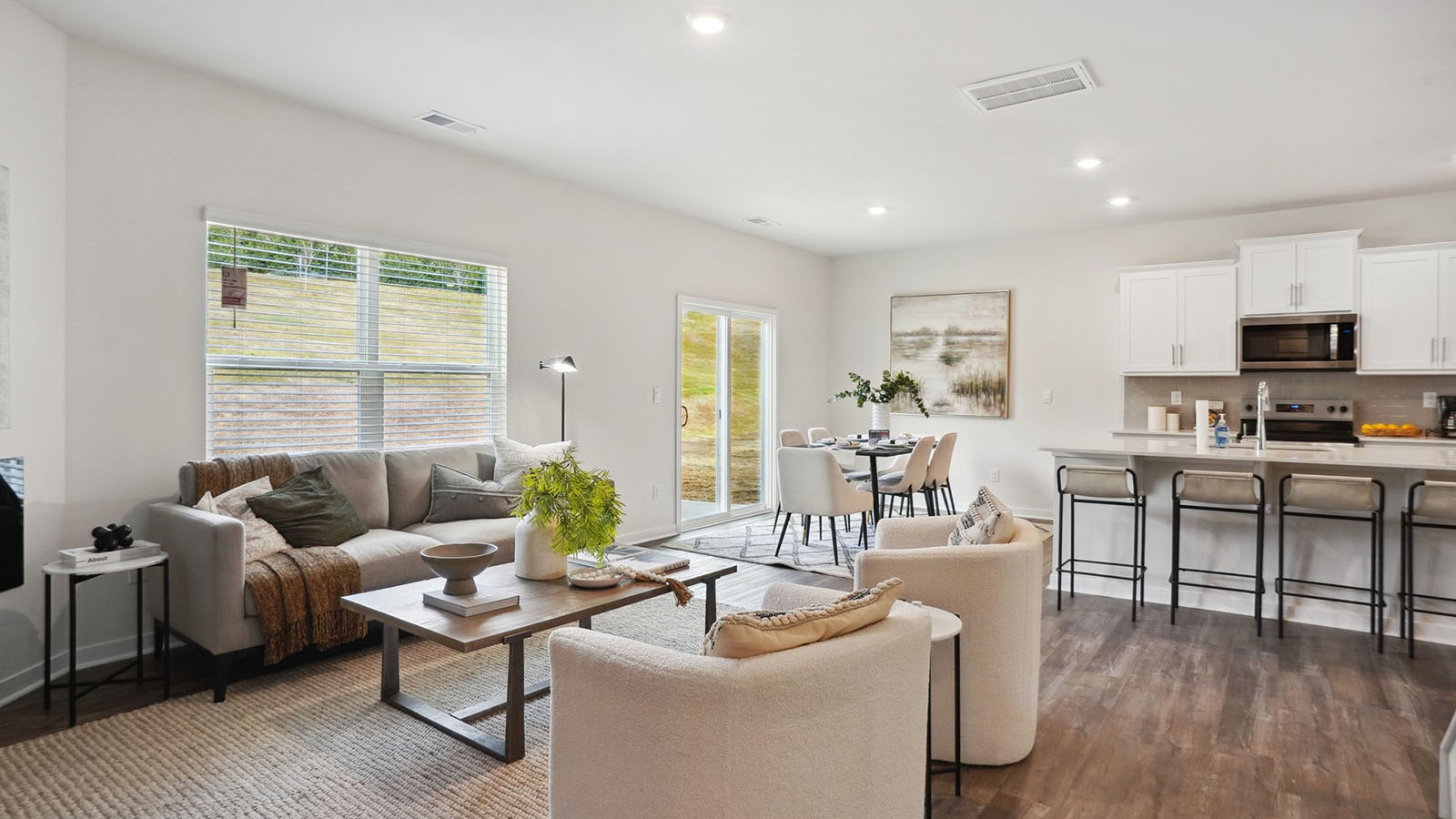 model open family room with windows and fireplace