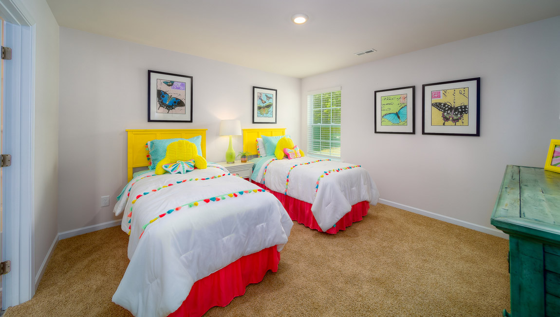 Carpeted bedroom with large window