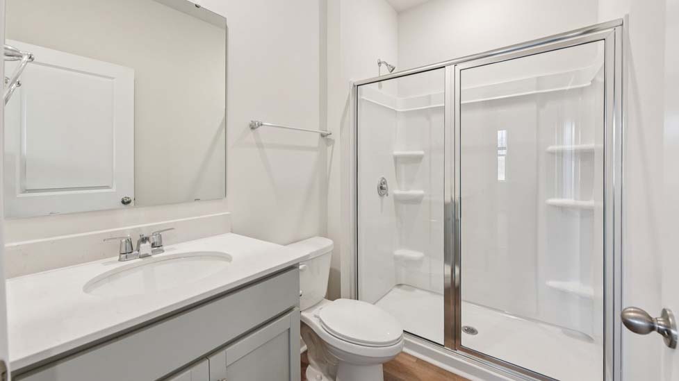 Bathroom with standing glass shower