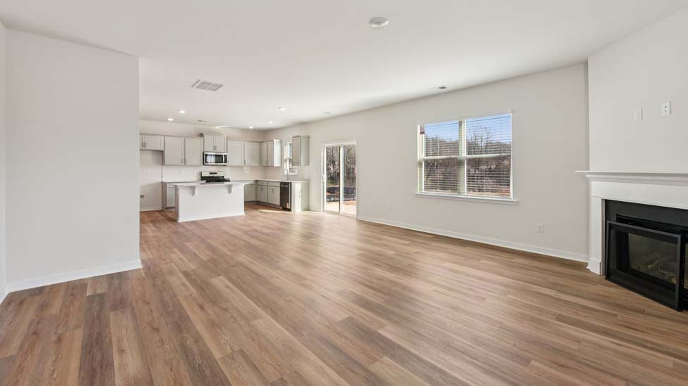 Living room area with fireplace and windows