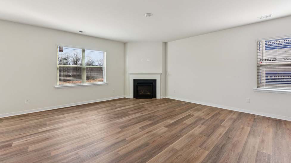 Living room area with fireplace and windows