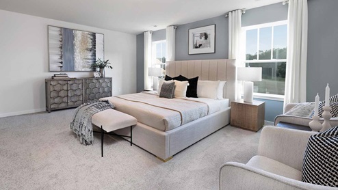 Primary bedroom with carpet and two large windows, New home near Charlotte, NC