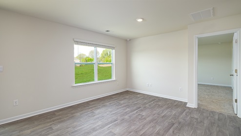 Great room with large window and wood floors