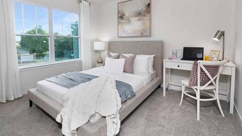 Carpeted bedroom with large window, New home near Charlotte, NC