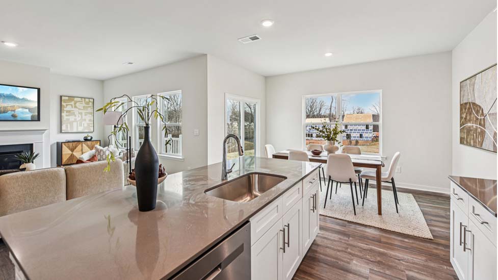 Kitchen and island with white cabinets