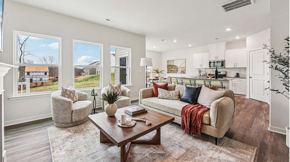 living room with fireplace and windows