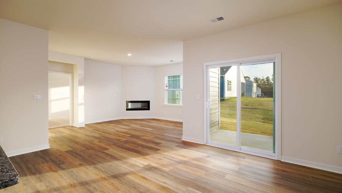 Kitchen and island with white cabinets and subway tiles and stainless steel subway tiles