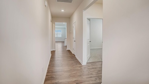 Welcoming foyer with wood floors