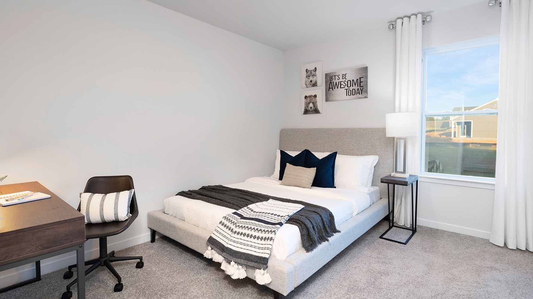 Carpeted bedroom with large window