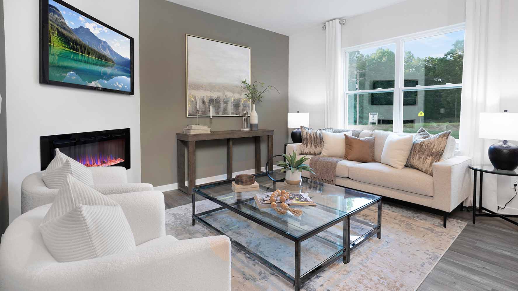 Living room with wood floors, fireplace and view of kitchen