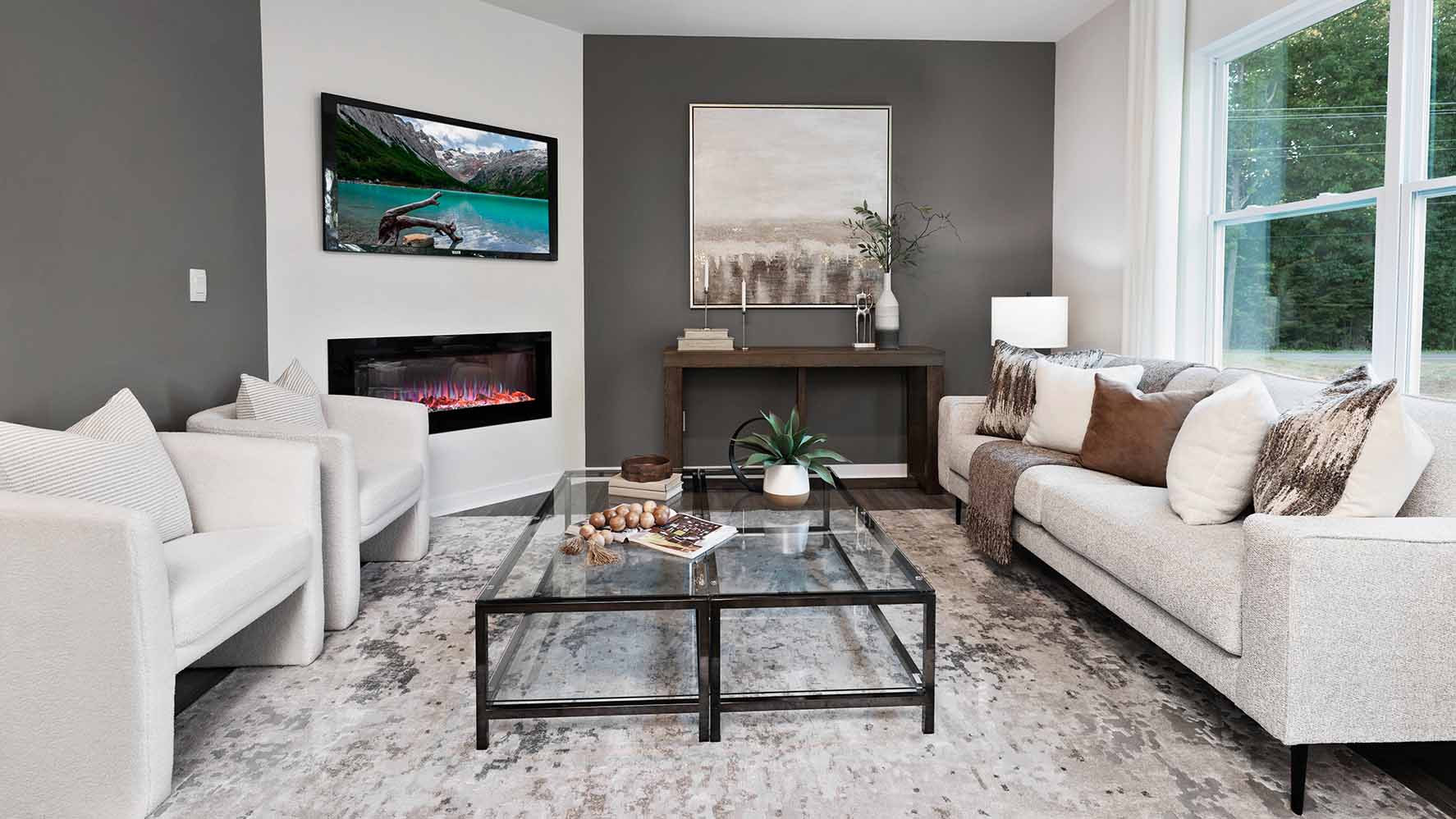 Living room with wood floors, fireplace and view of kitchen