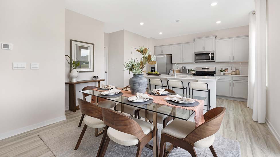 Kitchen and island with white cabinets