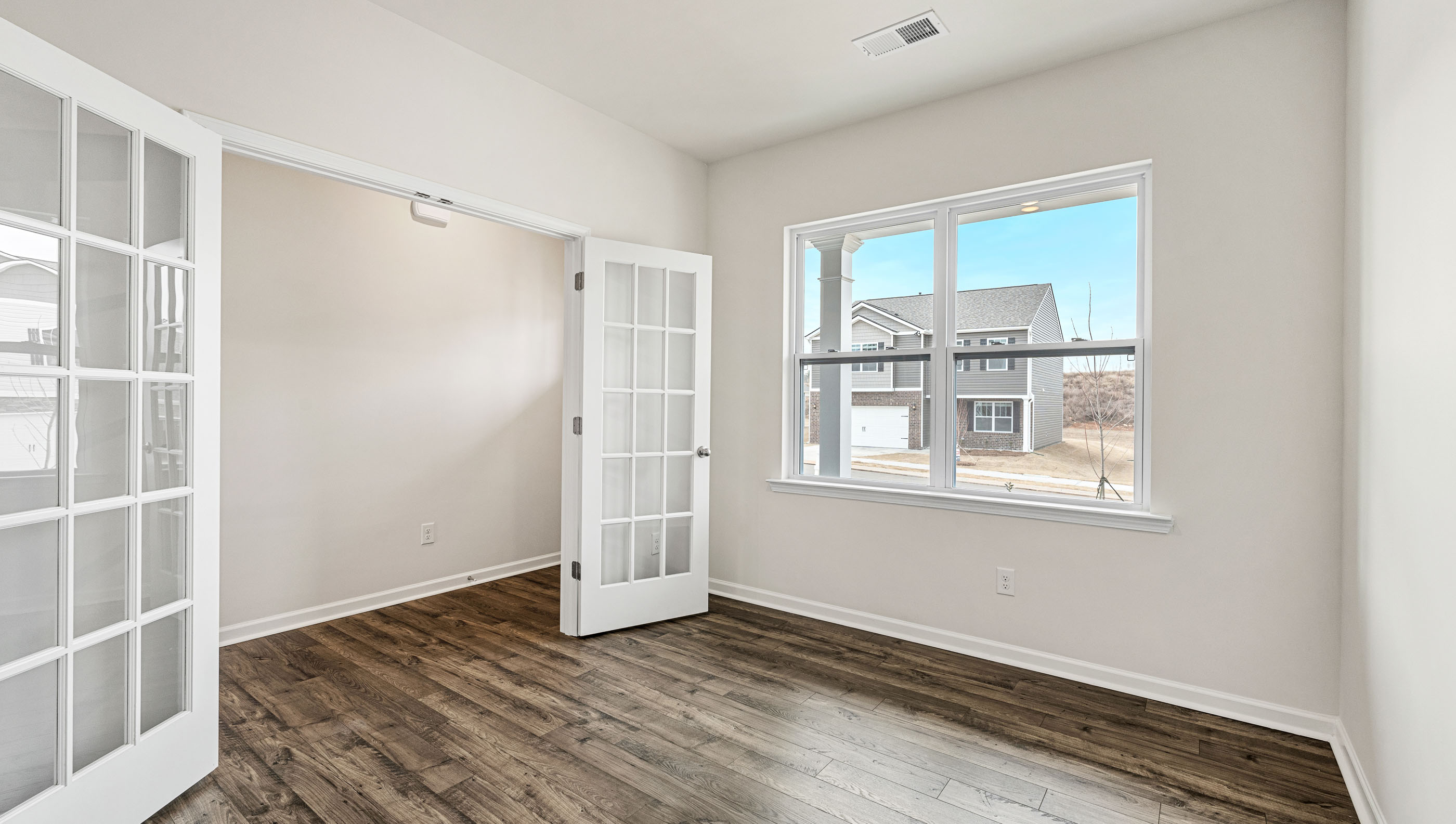Flex room with wood floors and french doors