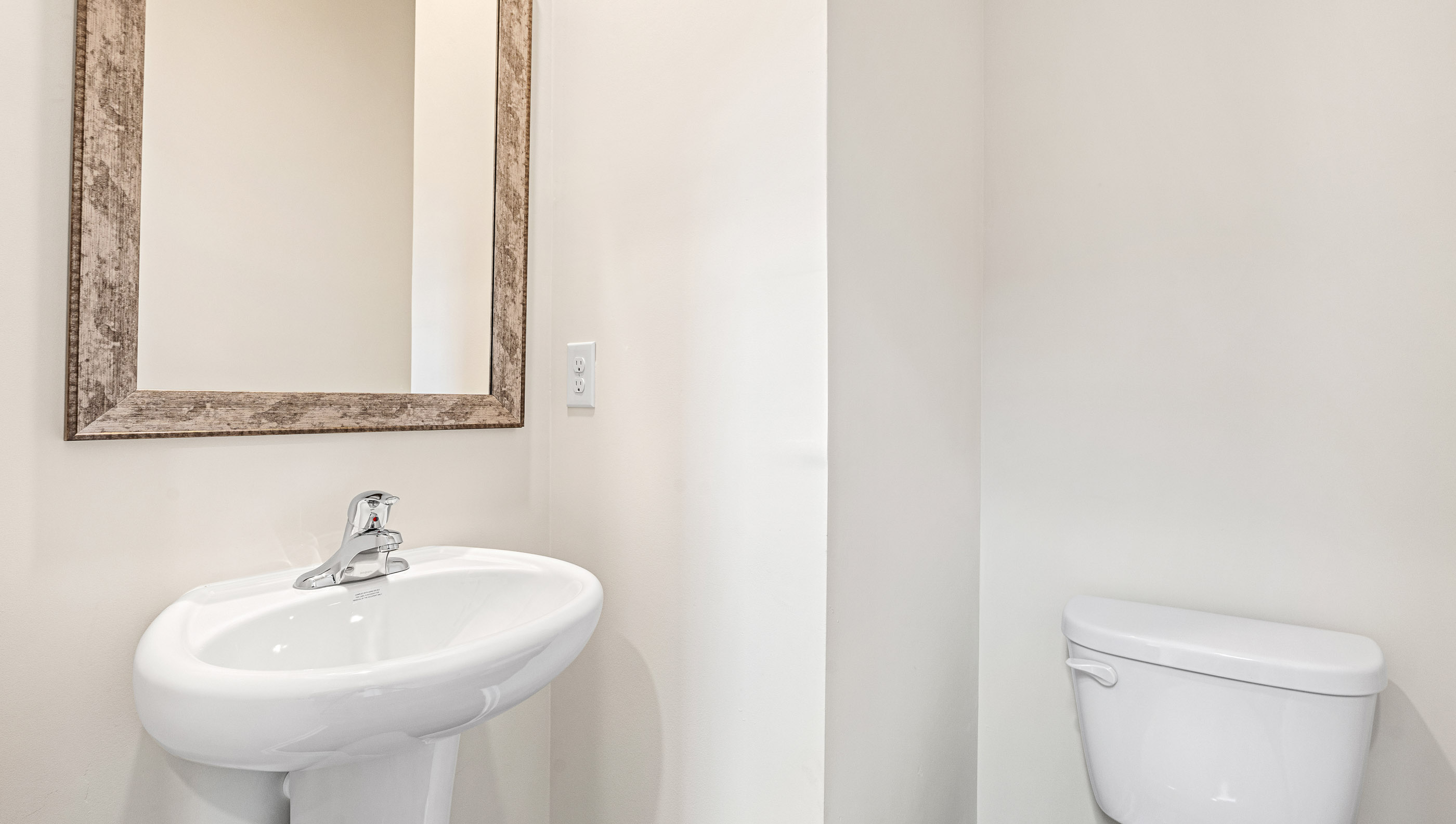 Powder bathroom with sink and toilet