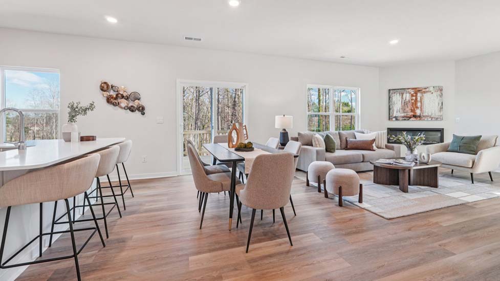 Dining area by kitchen, beside sliding glass doors outside