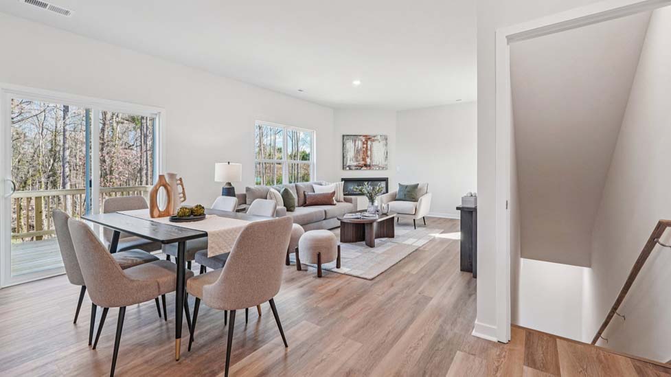Dining area by kitchen, beside sliding glass doors outside