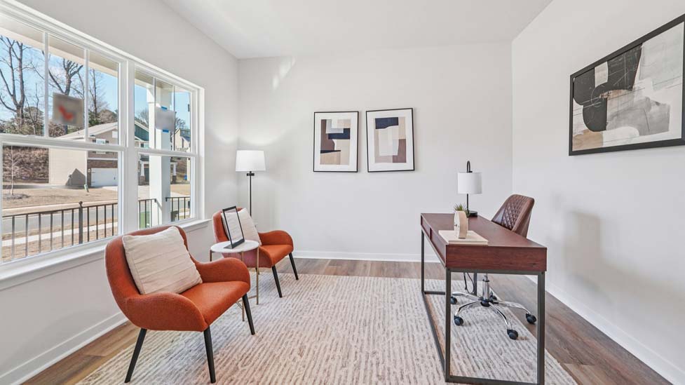 Flex office space with hardwood floors and large window