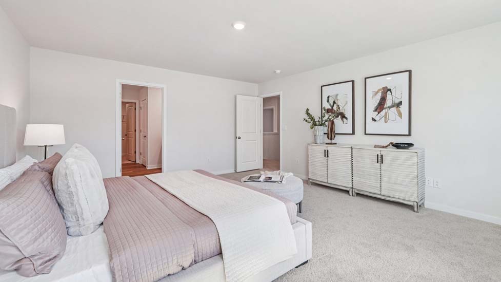 Bedroom carpeted with window