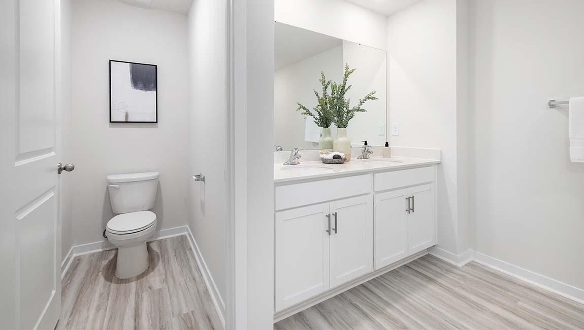 Primary bathroom with glass door shower, and bathtub