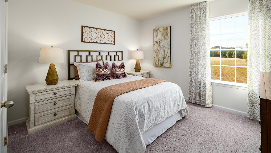 Carpeted bedroom with small window