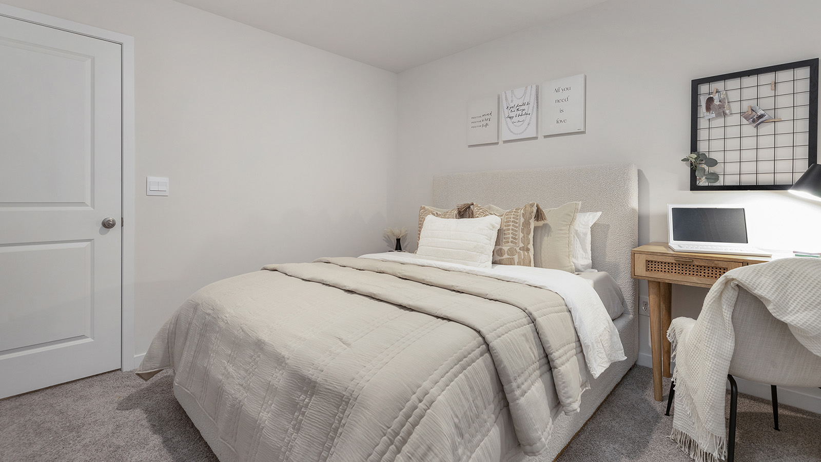 Carpeted bedroom  with small window