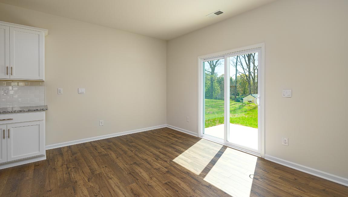 Dining room beside kitchen with sliding glass back door