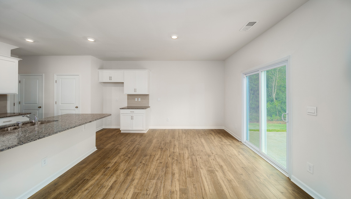 Dining room beside kitchen with sliding glass back door