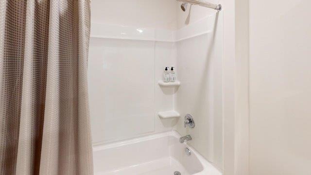 Bathroom featuring dual vanity sinks, with a mirror above