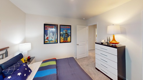 Bedroom featuring navy blue space decor