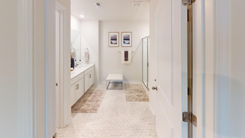 Spacious bathroom featuring dual vanity sinks