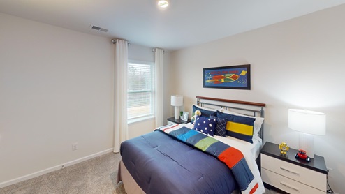 Bedroom featuring navy blue space decor