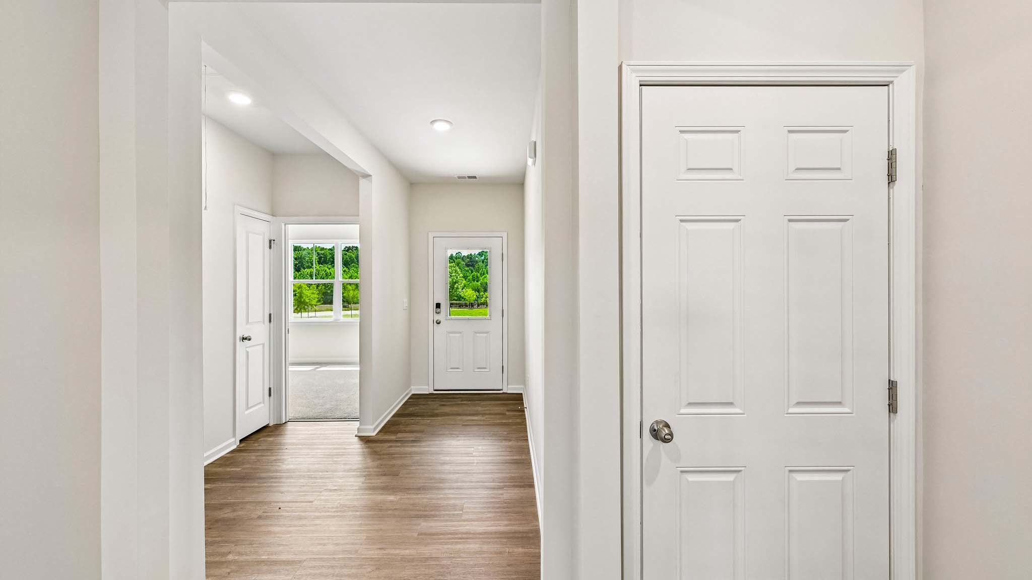 Welcoming foyer with wood floors, view of home interior