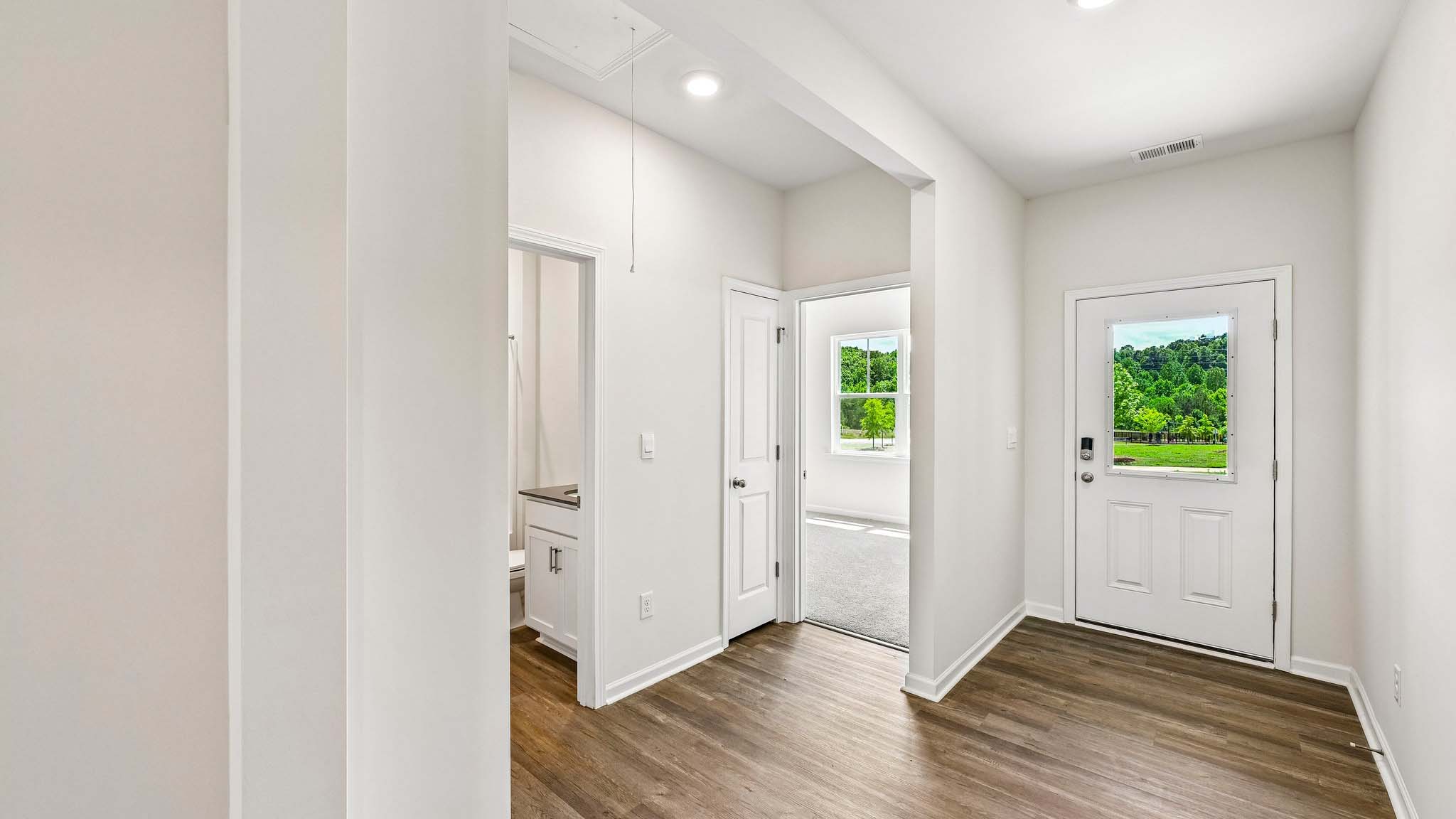 Welcoming foyer with wood floors, view of home interior